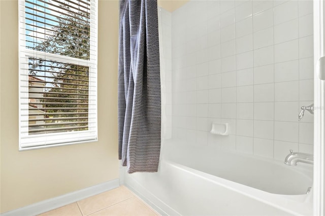 bathroom featuring shower / bath combo and tile patterned floors