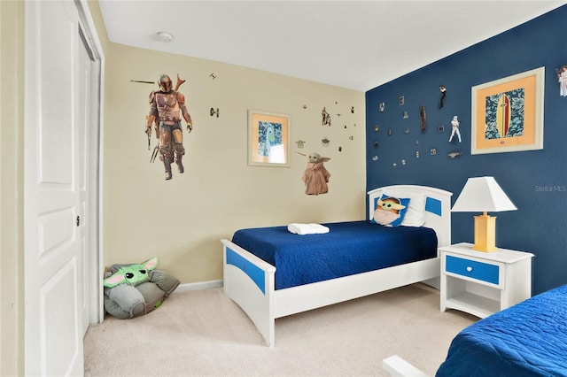 bedroom featuring carpet flooring and a closet