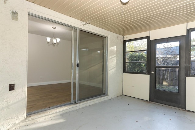 doorway to property featuring stucco siding