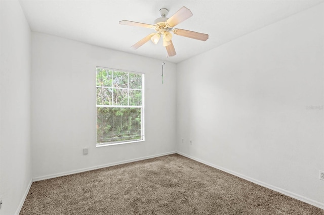 carpeted empty room with ceiling fan