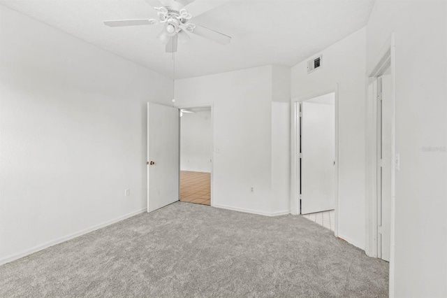 unfurnished bedroom featuring ceiling fan and light colored carpet