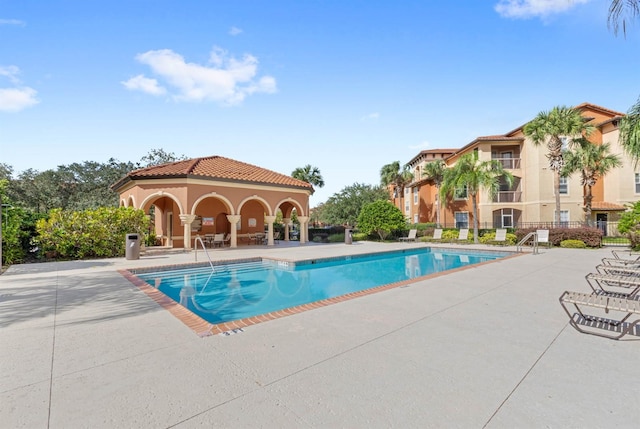 view of swimming pool featuring a patio