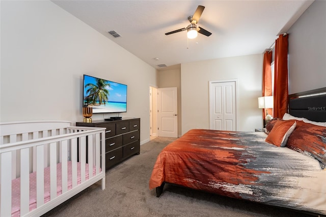 carpeted bedroom featuring a closet and ceiling fan