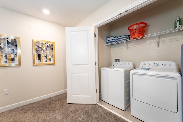 4537 Target Blvd, Kissimmee, FL 34746 - laundry area featuring washer and clothes dryer, light carpet, and baseboards