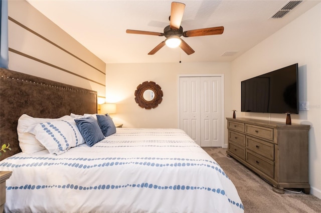 bedroom with light colored carpet, a closet, and ceiling fan