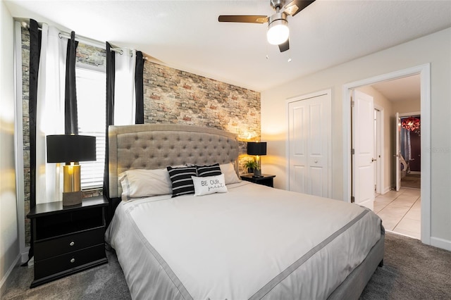 carpeted bedroom with a closet and ceiling fan