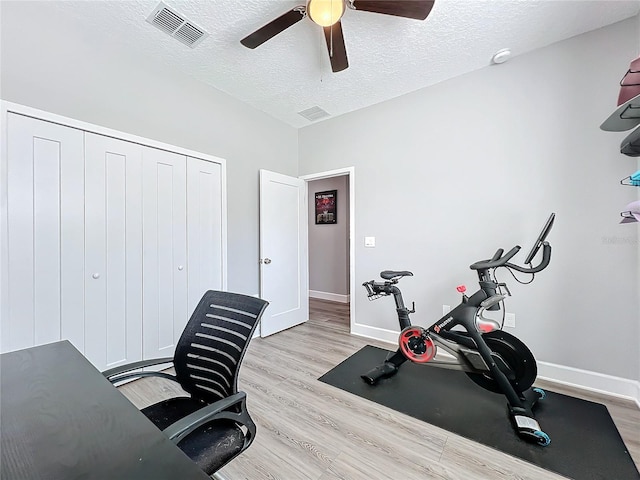 office area featuring ceiling fan, a textured ceiling, and light wood-type flooring