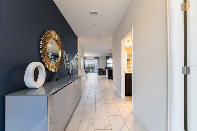 corridor with a textured ceiling