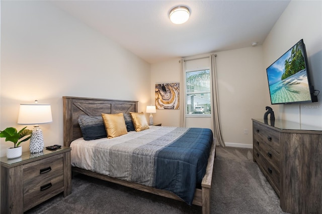 bedroom featuring dark carpet