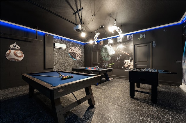 recreation room with a textured ceiling, a wall mounted AC, and billiards