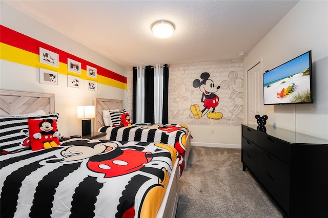 carpeted bedroom with a textured ceiling