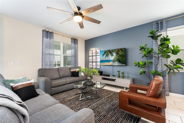 living room with ceiling fan and a wealth of natural light