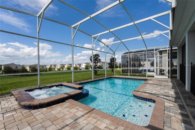 8896 Cabot Cliffs Dr, Davenport, FL 33896 - view of swimming pool with a patio, a pool with connected hot tub, a lawn, and glass enclosure