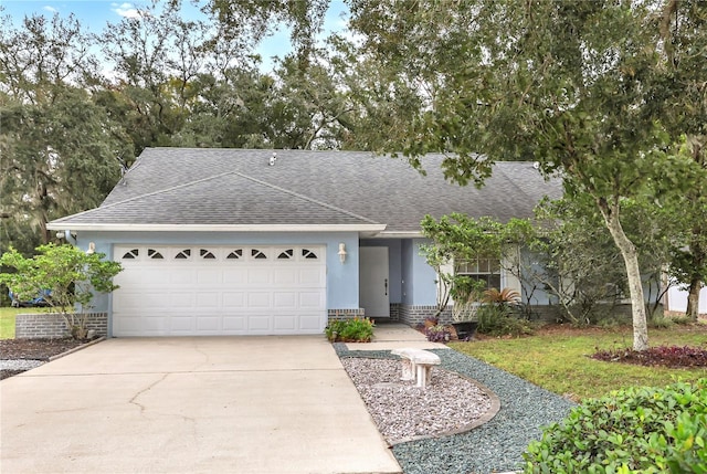 single story home with a garage