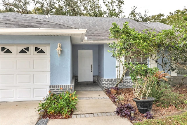 doorway to property featuring a garage