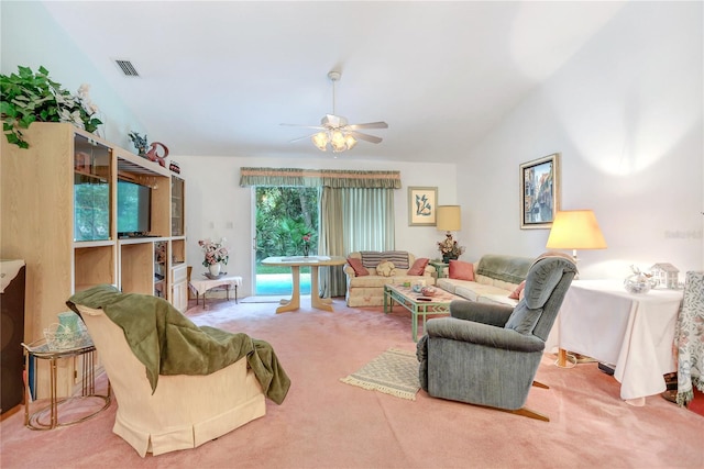 living room with lofted ceiling, carpet floors, and ceiling fan