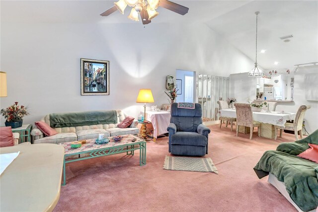 living room featuring carpet, high vaulted ceiling, and ceiling fan