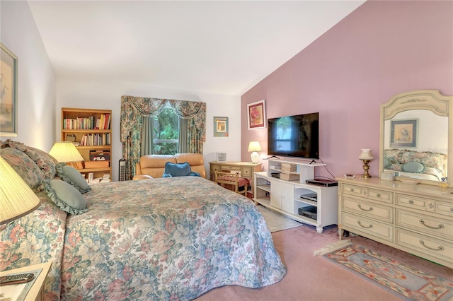 carpeted bedroom with vaulted ceiling