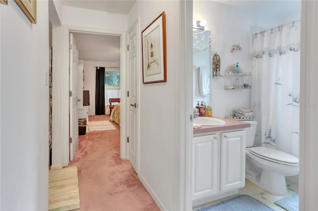 bathroom with vanity and toilet