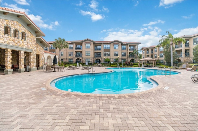 view of pool featuring a gazebo and a patio area