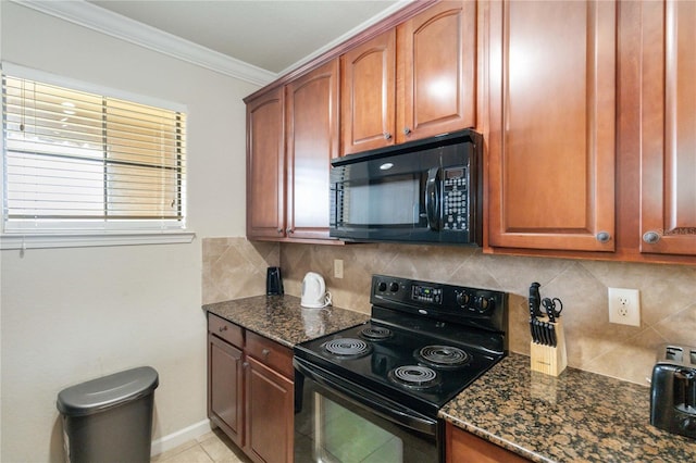 kitchen featuring crown molding, tasteful backsplash, black appliances, and dark stone counters