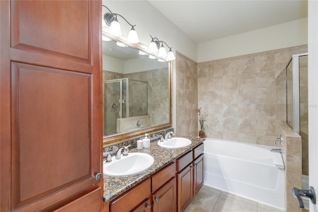 bathroom with vanity, independent shower and bath, and tile patterned floors