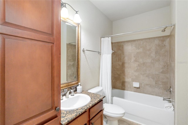 full bathroom with vanity, shower / tub combo, and toilet