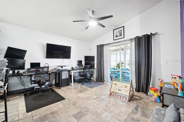 office with a ceiling fan, stone tile flooring, and lofted ceiling