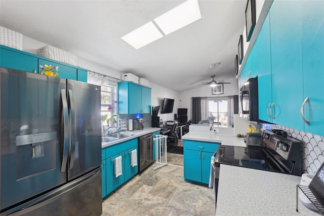 kitchen featuring decorative backsplash, ceiling fan, vaulted ceiling, black appliances, and blue cabinets