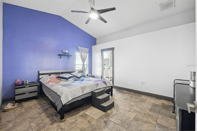 bedroom with a ceiling fan, visible vents, stone finish floor, vaulted ceiling, and baseboards