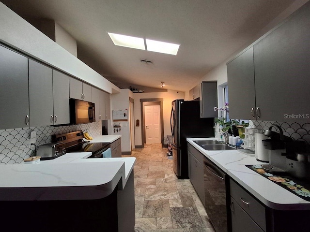 7940 Fashion Loop, New Port Richey, FL 34654 - kitchen with dishwashing machine, range with electric cooktop, black microwave, tasteful backsplash, and vaulted ceiling