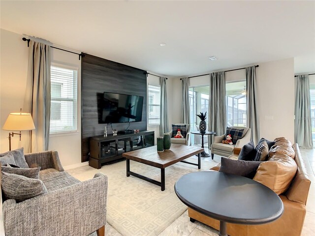 1861 Sawyer Palm Pl, Kissimmee, FL 34747 - living area featuring plenty of natural light and an accent wall