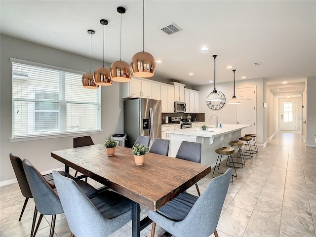 tiled dining area with sink