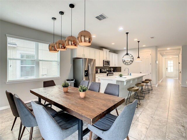 1861 Sawyer Palm Pl, Kissimmee, FL 34747 - dining space featuring baseboards, recessed lighting, and light tile patterned floors
