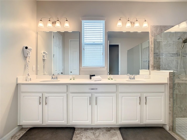 bathroom with vanity and a tile shower