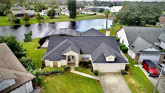 birds eye view of property with a water view