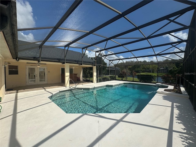 view of swimming pool with a patio, french doors, and a lanai