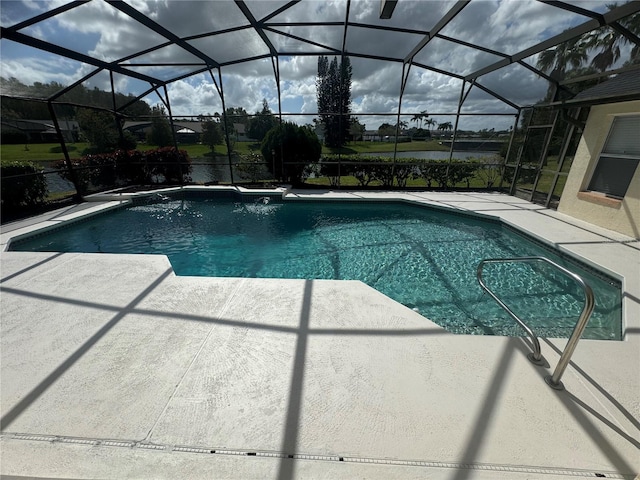 view of pool featuring pool water feature, a patio area, and a lanai