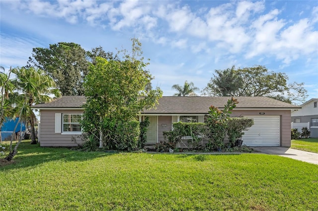 ranch-style home featuring a front lawn and a garage