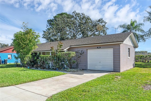 single story home with a front lawn and a garage