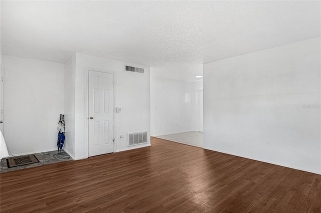 2319 Continental Blvd, Orlando, FL 32808 - spare room featuring baseboards, wood finished floors, and visible vents
