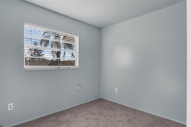 2319 Continental Blvd, Orlando, FL 32808 - carpeted spare room with a textured ceiling and baseboards