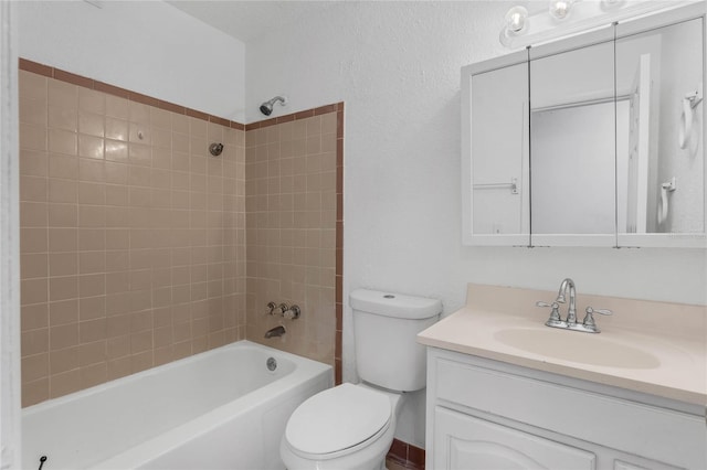 full bathroom with vanity, toilet, and tiled shower / bath