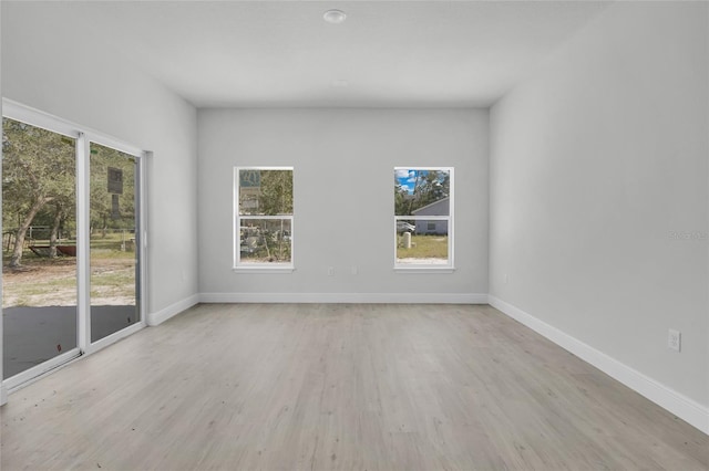 unfurnished room featuring light hardwood / wood-style floors