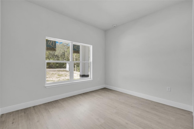 unfurnished room featuring light hardwood / wood-style floors