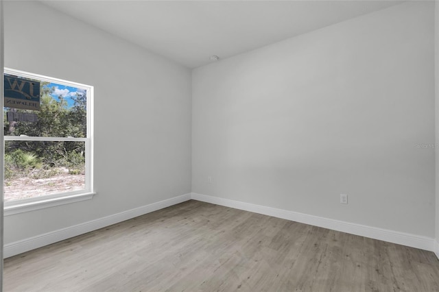 spare room featuring light wood-type flooring