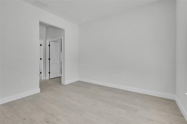 spare room with light hardwood / wood-style floors