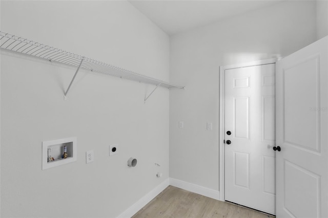 laundry area with electric dryer hookup, washer hookup, and light wood-type flooring