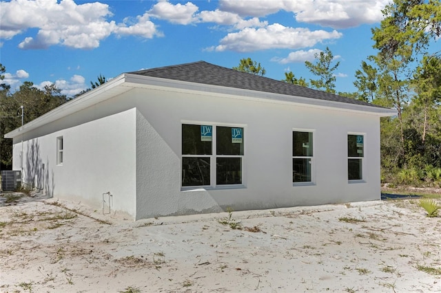 back of property featuring cooling unit