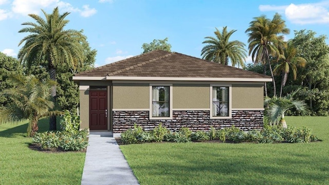 1584 Hummingbird Rd, Winter Haven, FL 33884 - view of front of home with stucco siding, a front yard, and stone siding